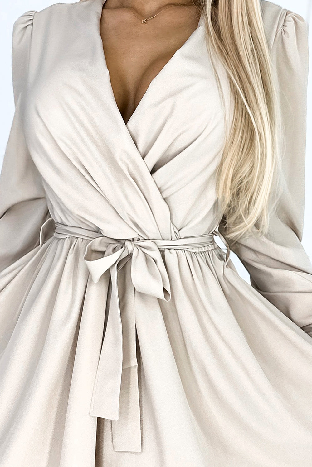 Feminine dress with a neckline and belt - beige