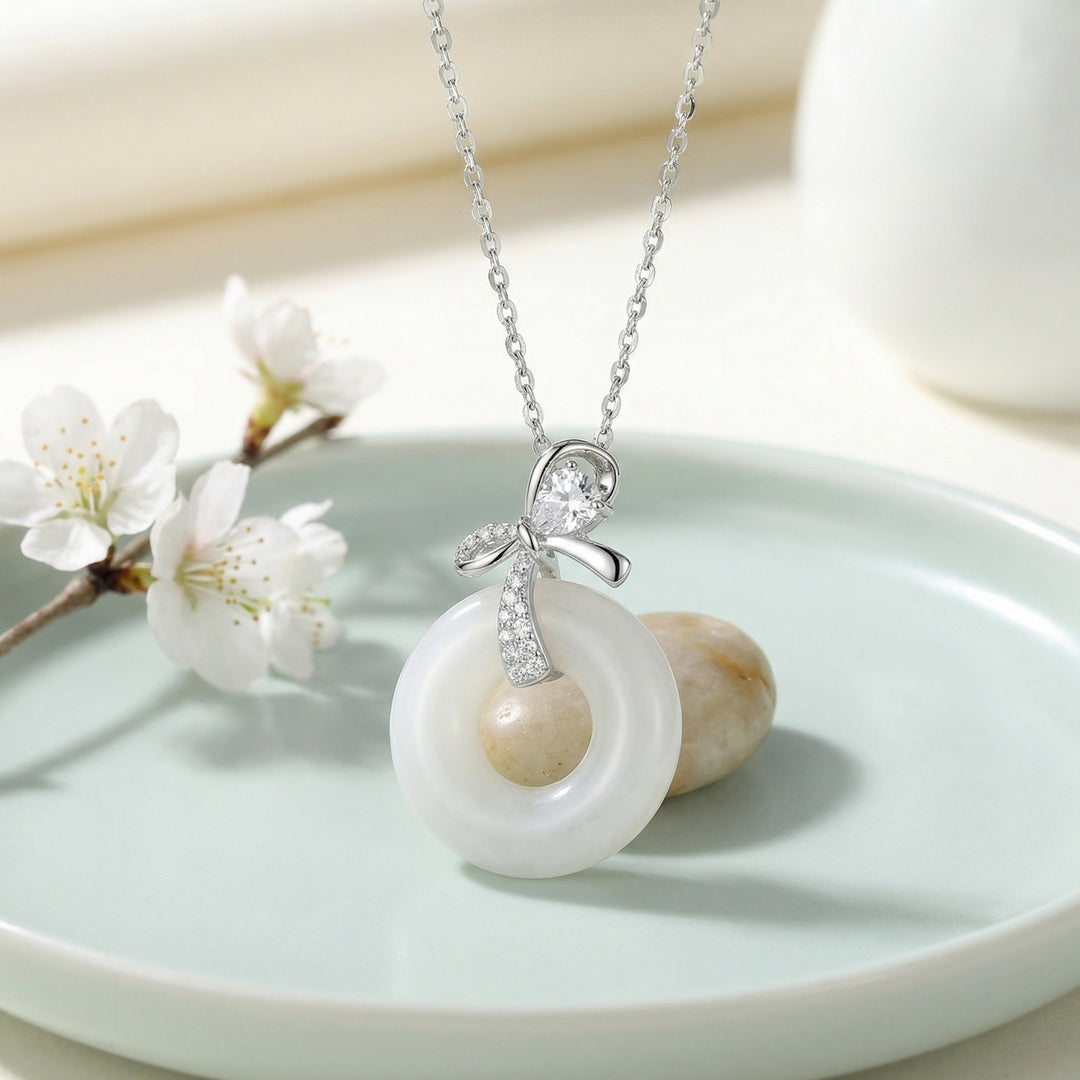 925 Sterling Silver Elegant White Jade Donut Pendant Necklace with Sparkling Silver Bow Accent