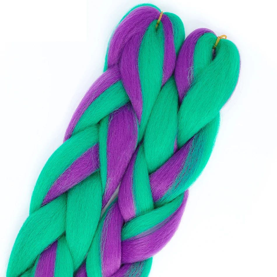 Braided hair extensions in green and purple on a white background