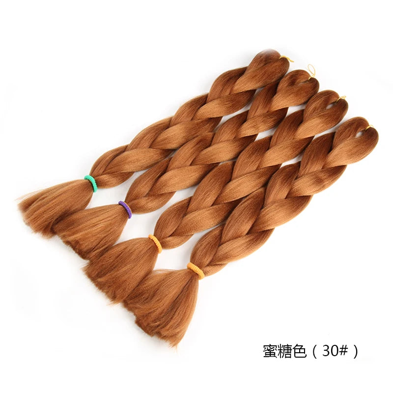 Three braided hair extensions in a honey color on a white background