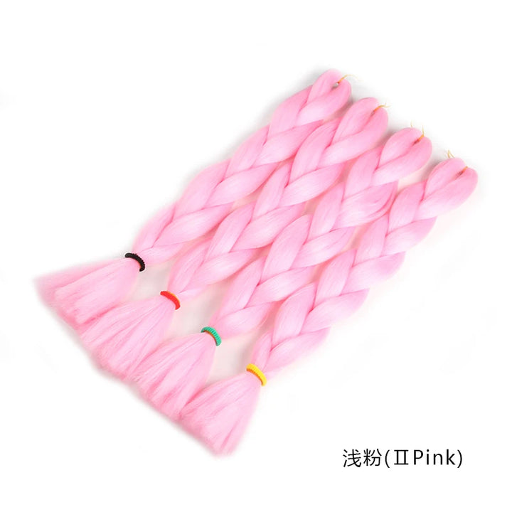 Pink synthetic hair extensions with color bands on a white background