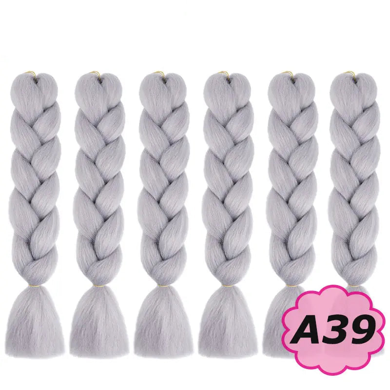 Gray braided hair extensions with on a white background.