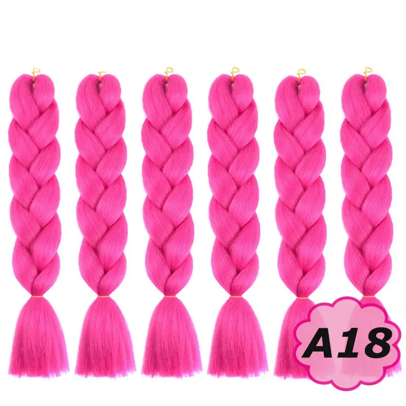 Pink braided hair extensions with on a white background.