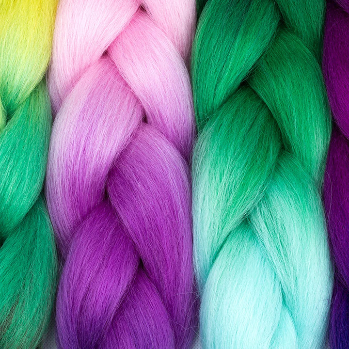 Close-up of braided yarn in green, pink, and purple colors.