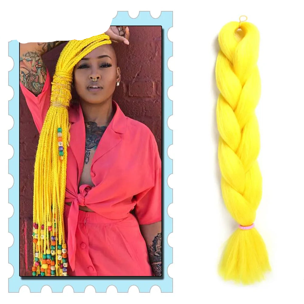 Yellow braided hair extension with a person wearing a pink jacket and colorful beads in the background