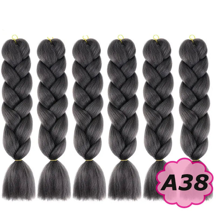 Six braided hair extensions with  on a white background.
