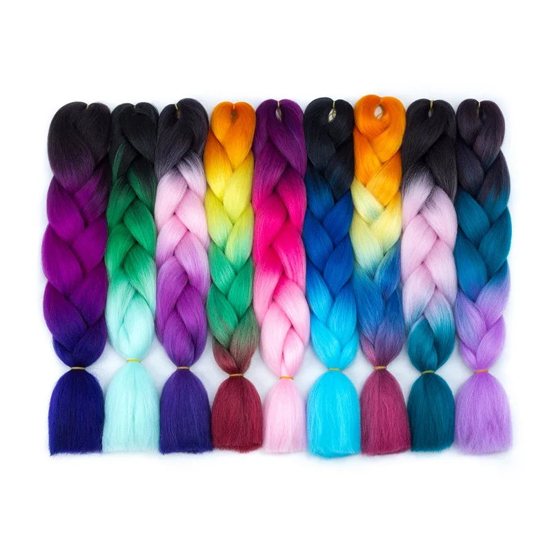 Colorful braided hair extensions in various shades on a white background