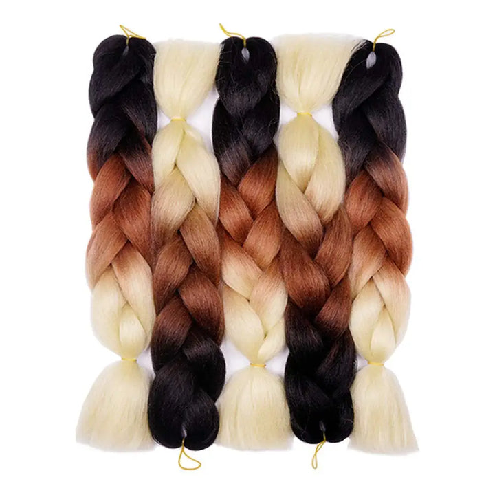 Set of braided hair extensions with ombre colors on a white background