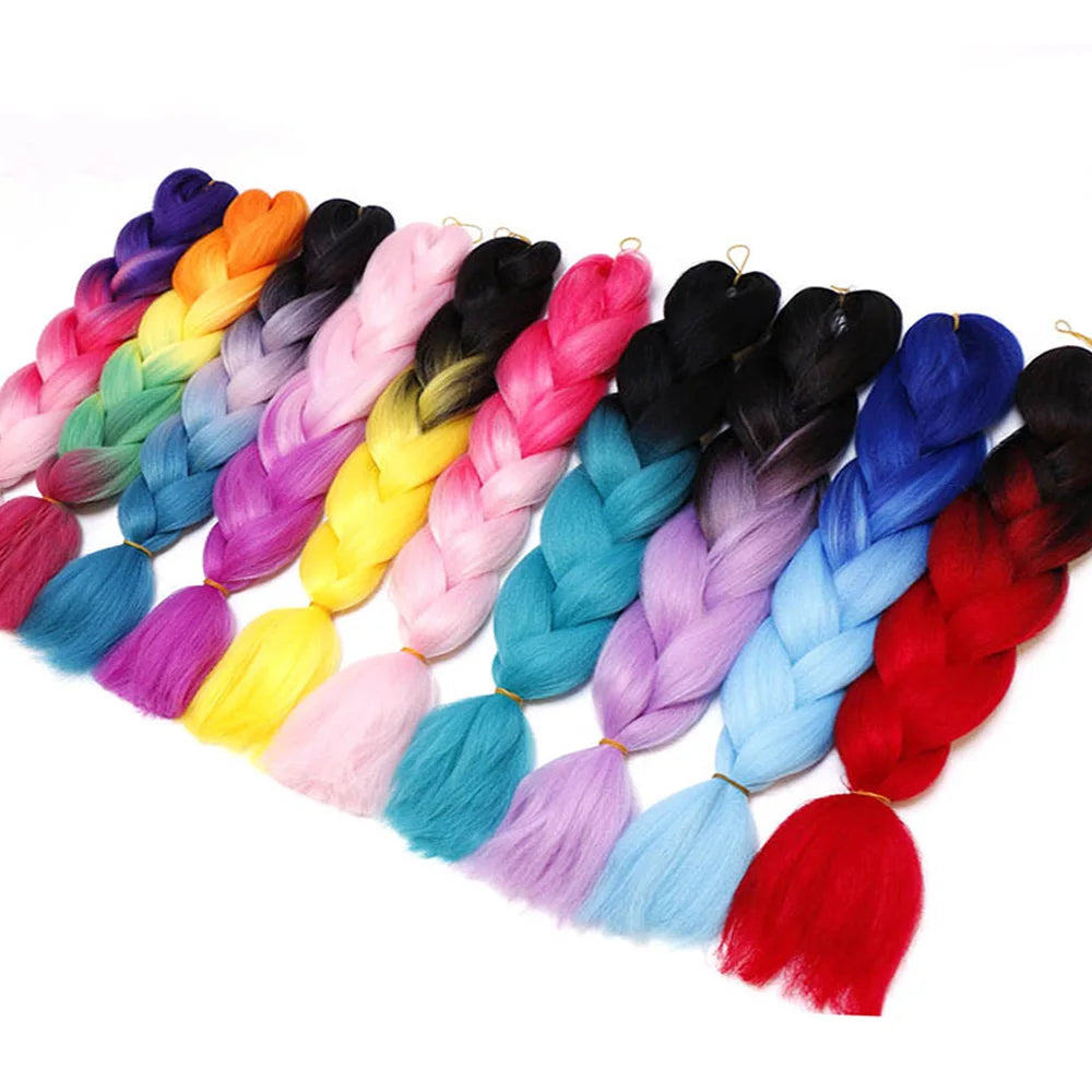 Assorted colorful braided hair extensions on a white background