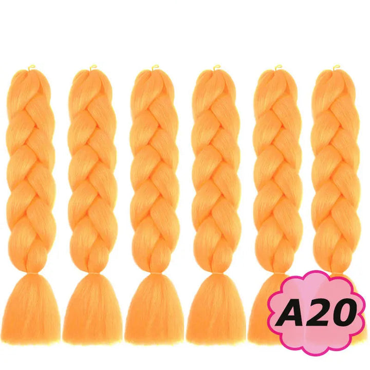 Orange braided hair extensions with  on a white background.