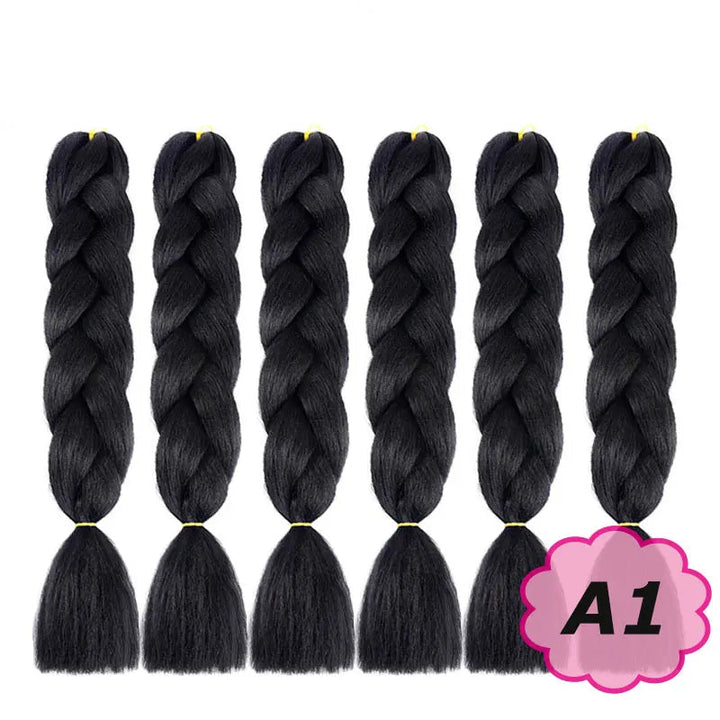 Black braided hair extensions with  on a white background.