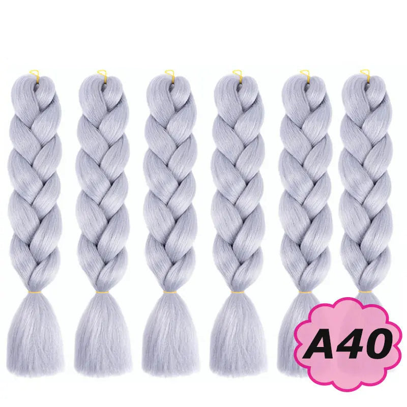 Set of six braided hair extensions with on a white background.