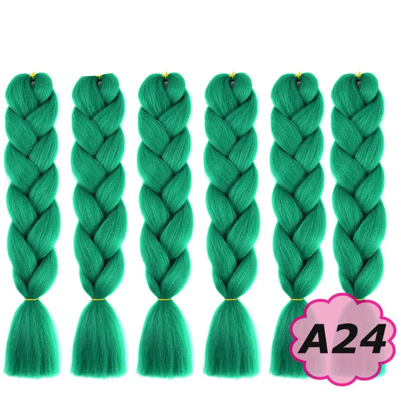 Green braided hair extensions with  on a white background.