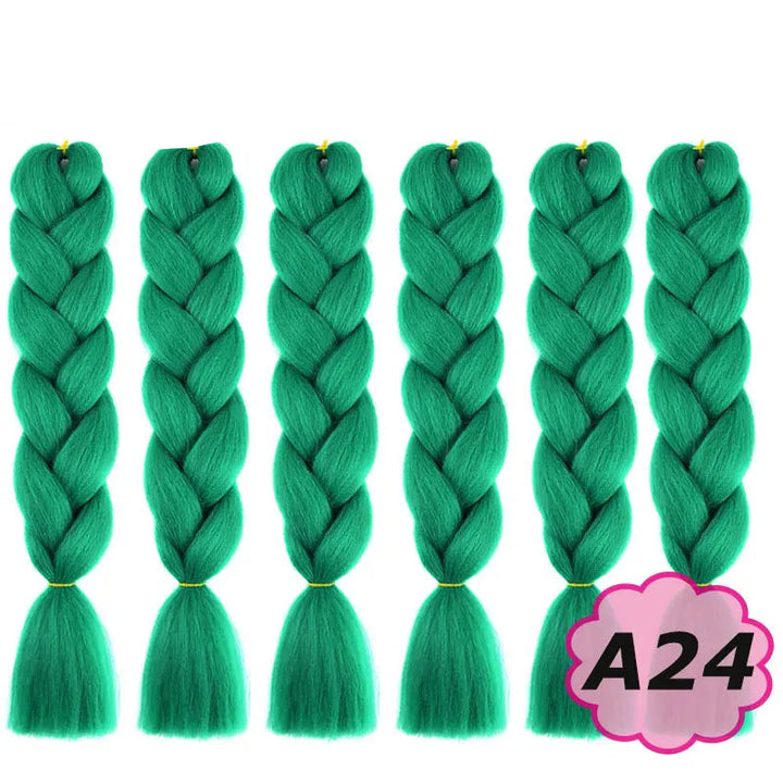 Green braided hair extensions with  on a white background.