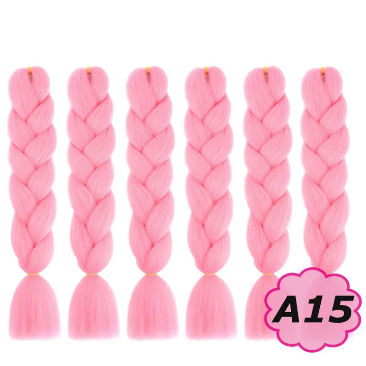 Pink braided hair extensions with  on a white background.