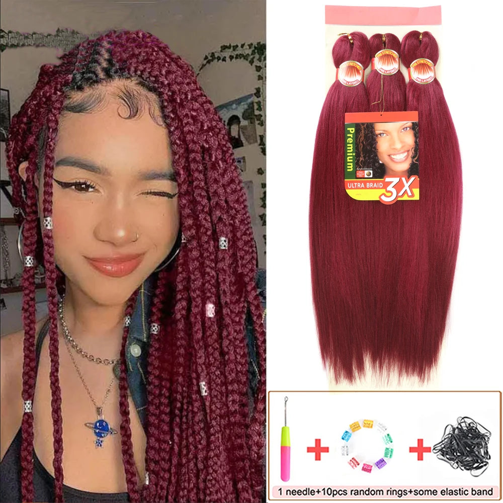 Woman with burgundy braided hair and a package of burgundy hair extensions with accessories.