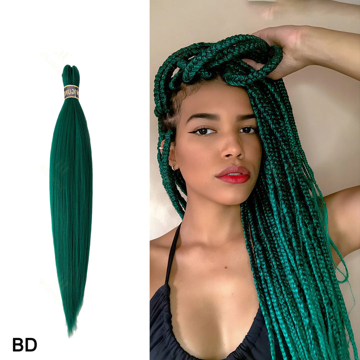 Green braided hair extensions with a model wearing them