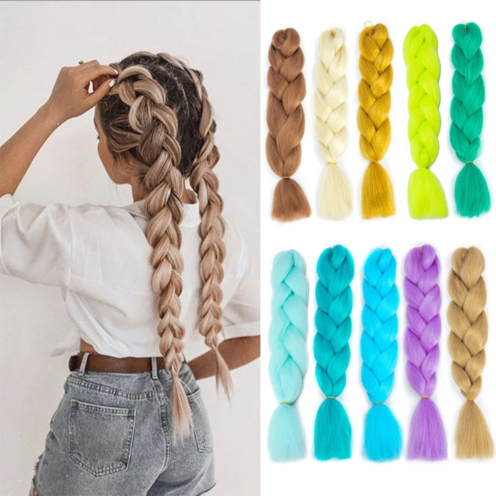 Person with braided hair and colorful braided hair extensions on a white background