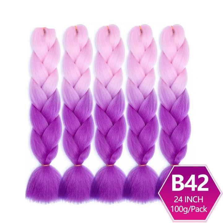 Purple and pink ombre braided hair extensions with on a white background.