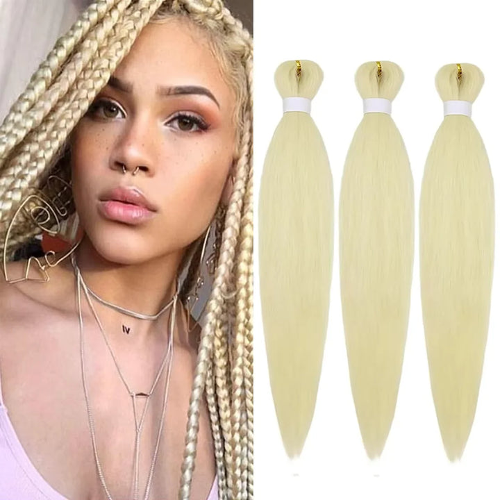 Woman with styled hair and three bundles of blonde hair extensions on a white background