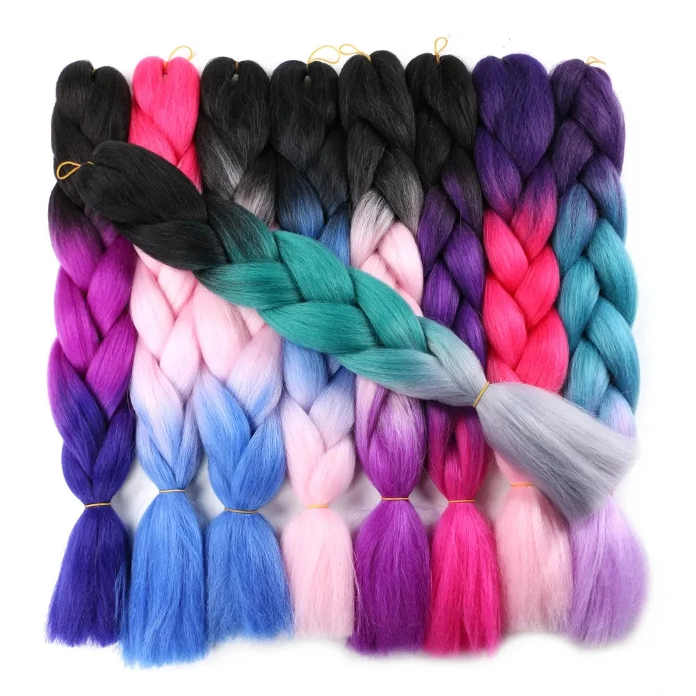 Assorted colorful braided hair extensions on a white background