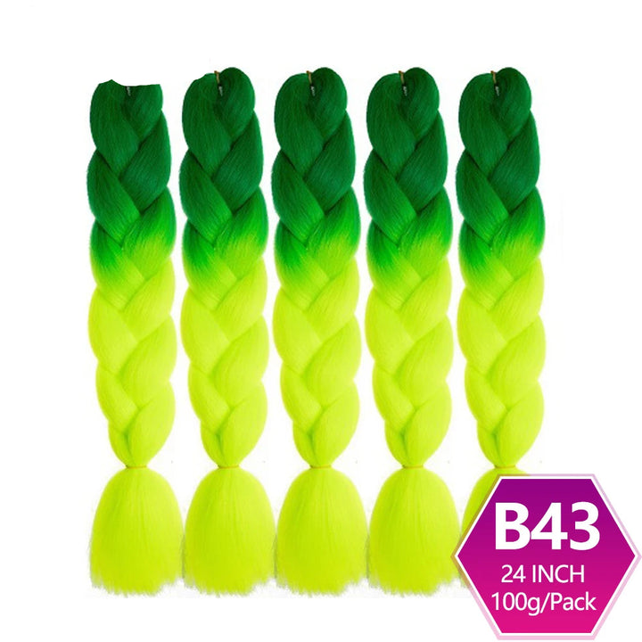 Five green to yellow ombre braided hair extensions with on a white background.