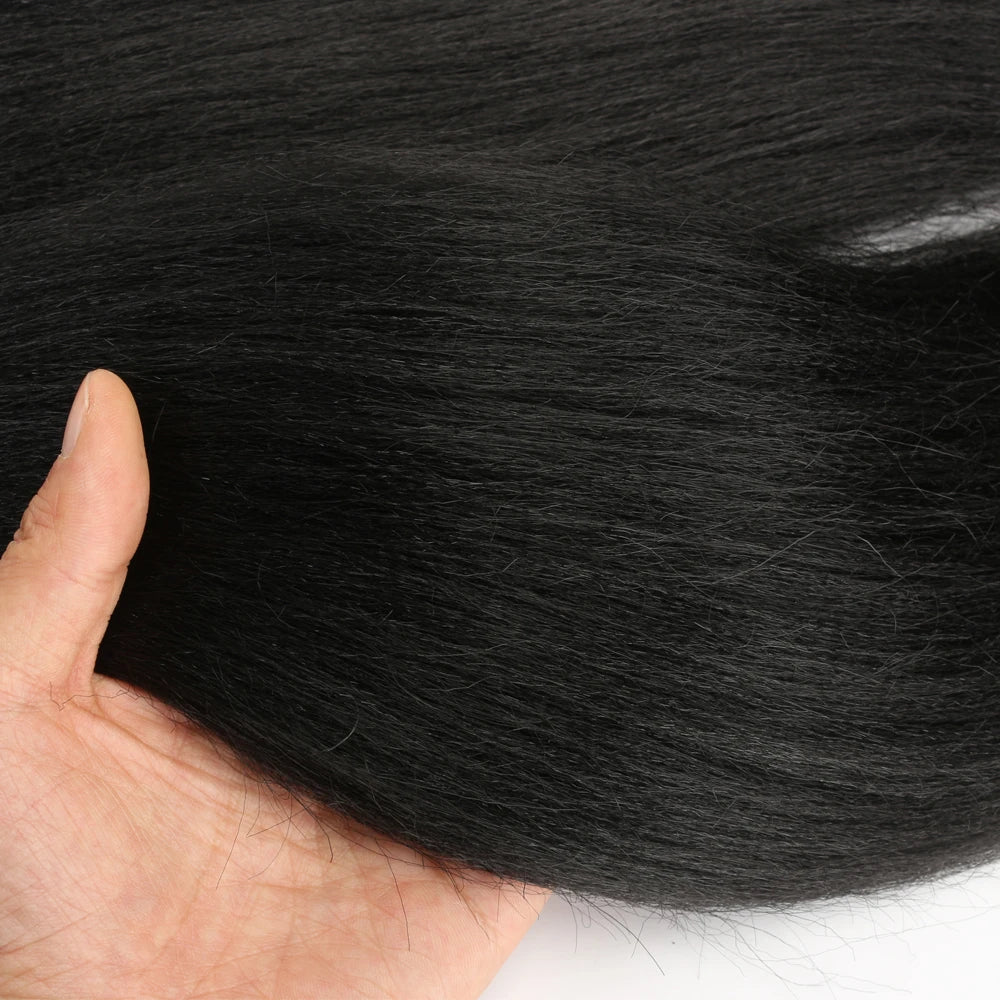 Close-up of a hand touching black fur