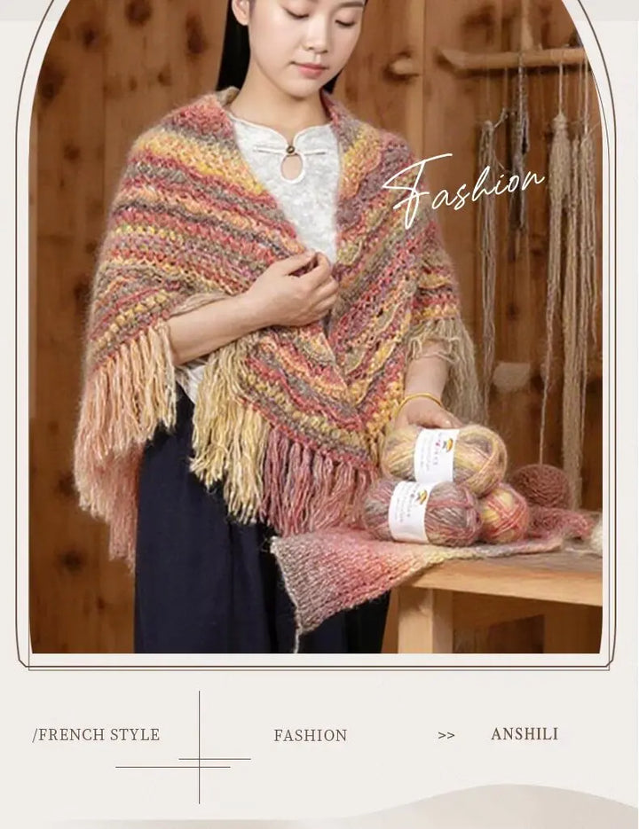 Woman wearing a colorful knitted shawl holding yarn balls with 'Fashion' text overlay.