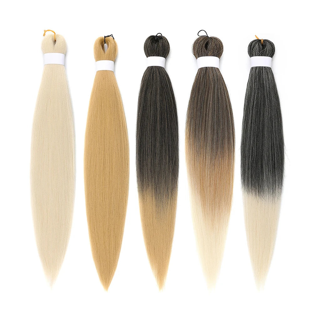 Five hair extensions in different colors on a white background