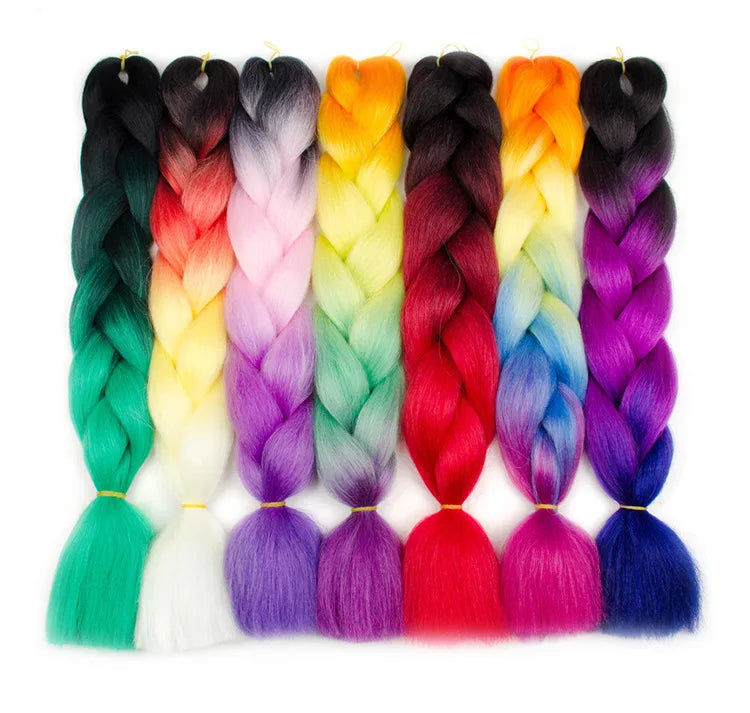Colorful braided hair extensions in various shades on a white background