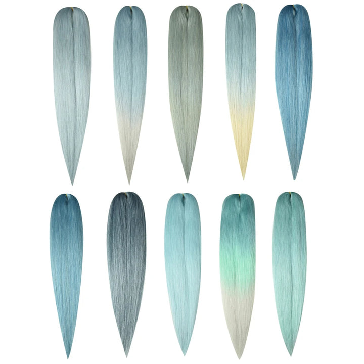 Set of gradient hair extensions in various blue and green shades on a white background