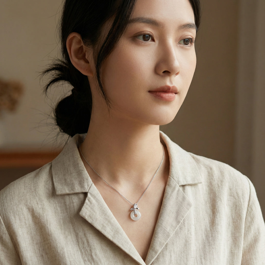 925 Sterling Silver Elegant White Jade Donut Pendant Necklace with Sparkling Silver Bow Accent