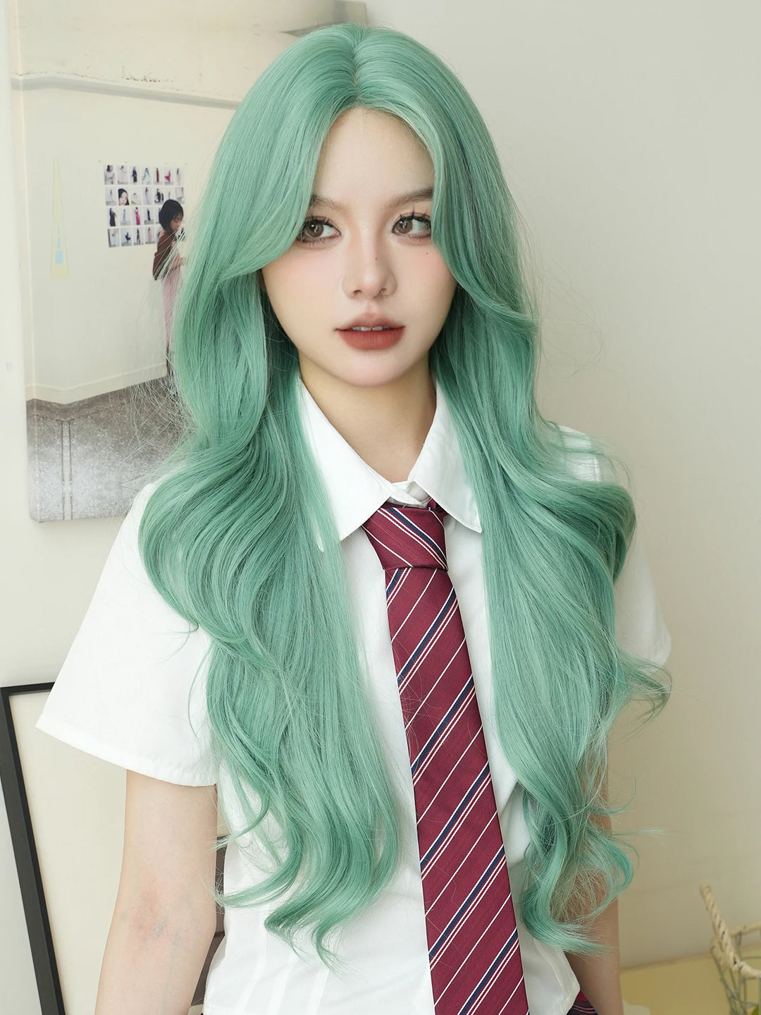 28-inch long water wave light green middle-parted synthetic matte hair wig for women. Heat-resistant lace front wig.