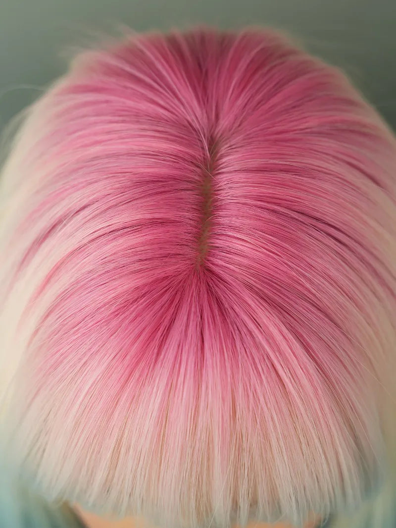 Ombre colored bob wig with bangs, perfect for cosplay or everyday wear.