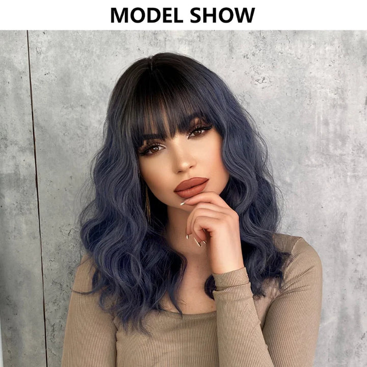 Short curly ombre blue wig with bangs for women. Shoulder-length wavy bob style made of synthetic hair. Perfect for daily wear, cosplay, and Halloween.
