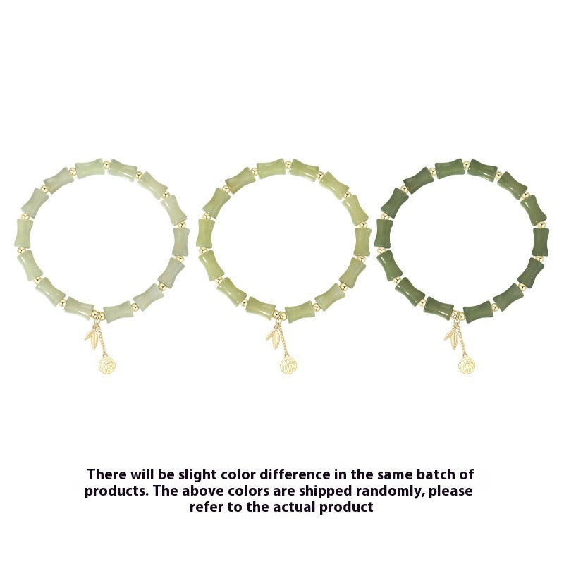 Three green necklaces with small pendants on a white background