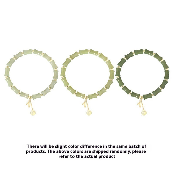 Three green necklaces with small pendants on a white background