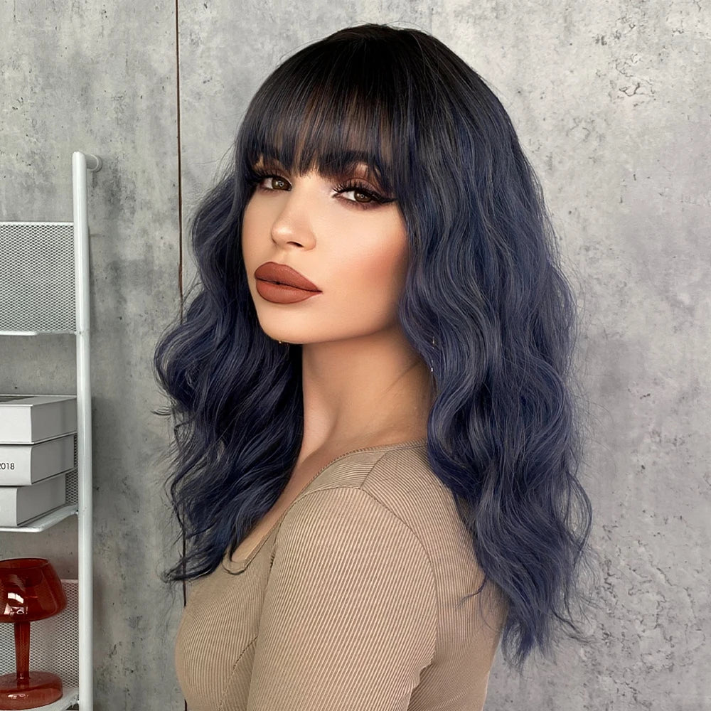 Short curly ombre blue wig with bangs for women. Shoulder-length wavy bob style made of synthetic hair. Perfect for daily wear, cosplay, and Halloween.