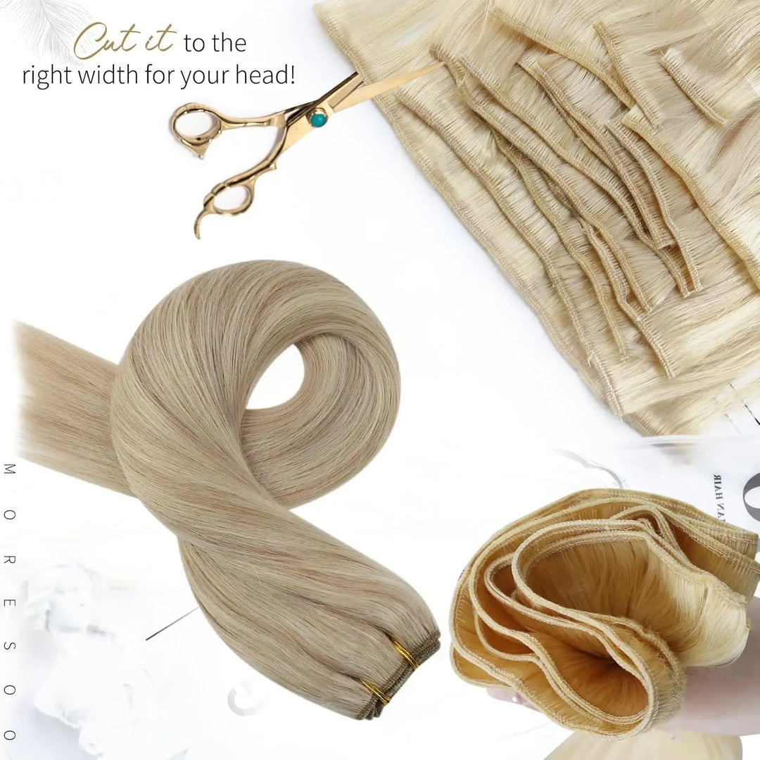 Blonde hair extensions with scissors on a white background