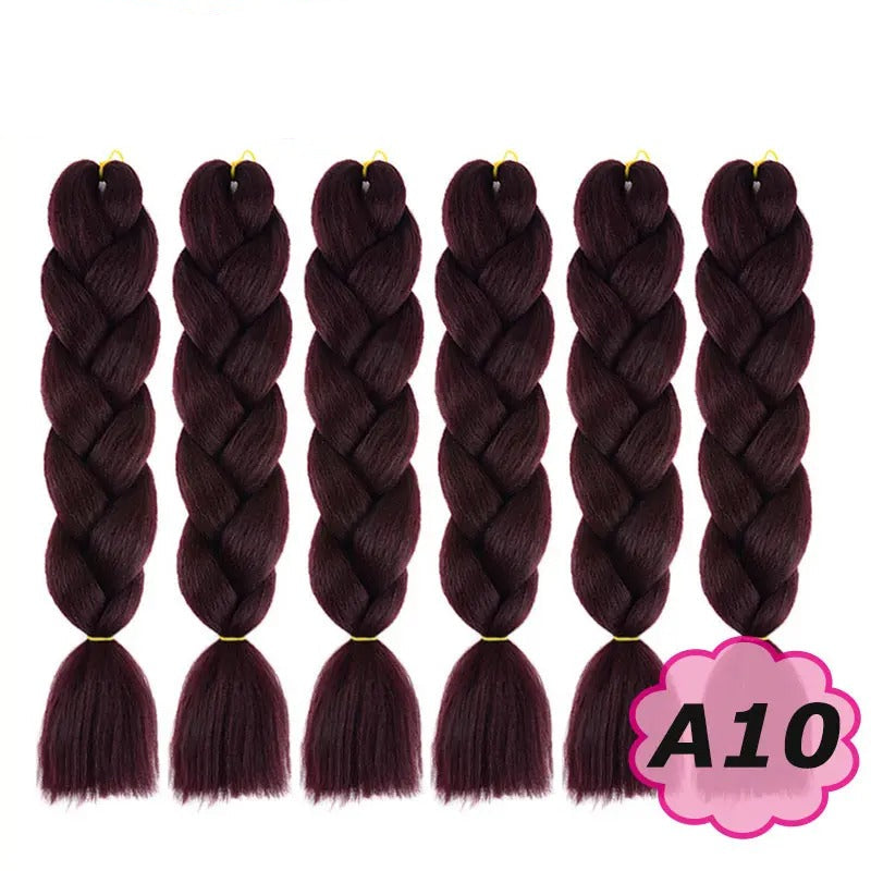 Six braided hair extensions with  branding and color label A10.