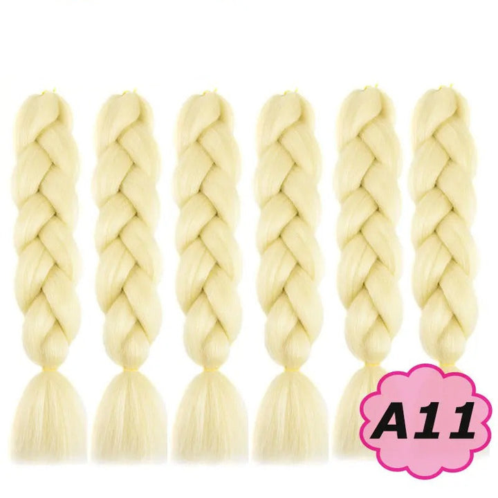 Set of six blonde braided hair extensions with  branding on a white background.