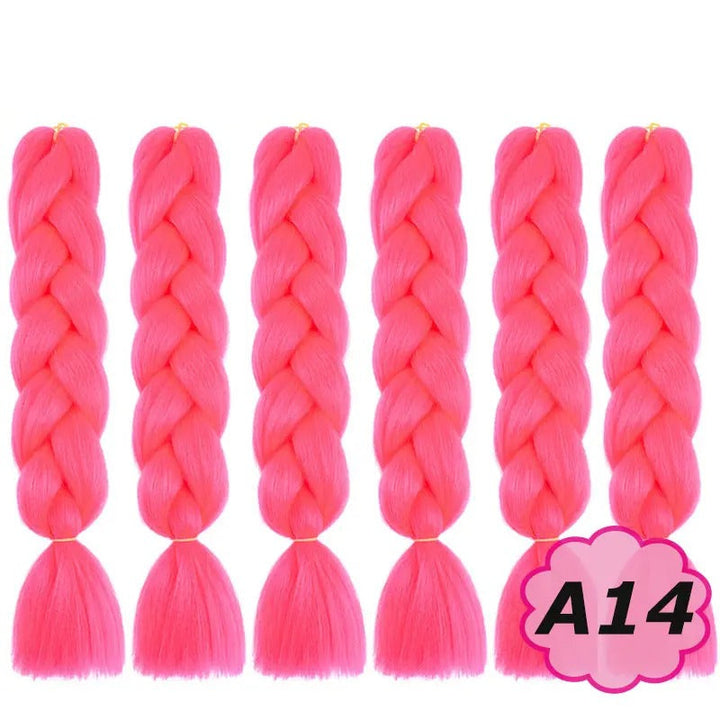 Pink braided hair extensions with branding on a white background.