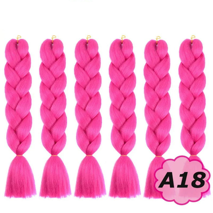 Pink braided hair extensions with  branding on a white background.