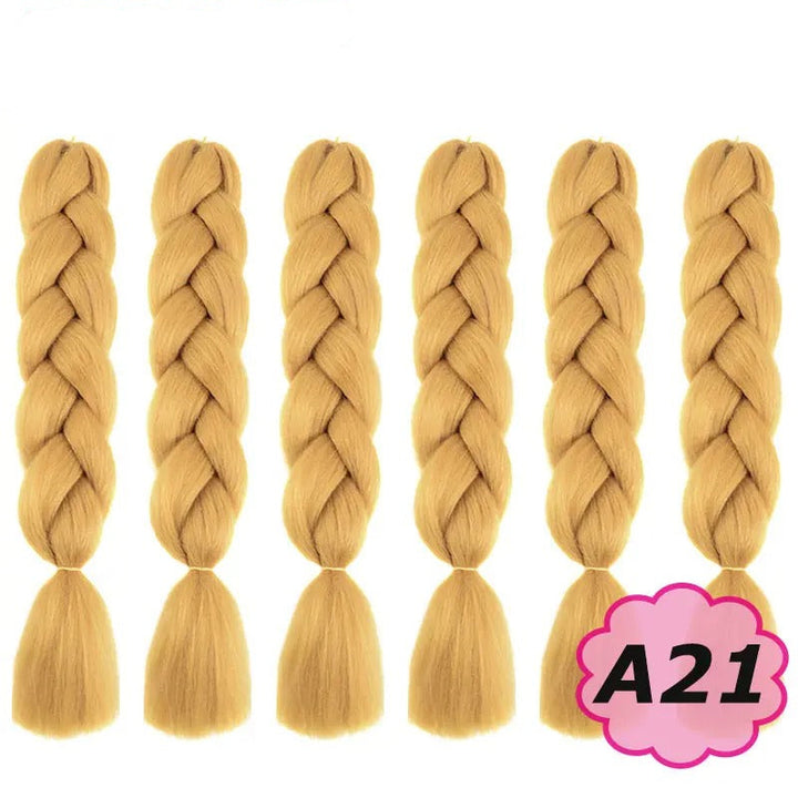 Set of six blonde braided hair extensions with branding on a white background.