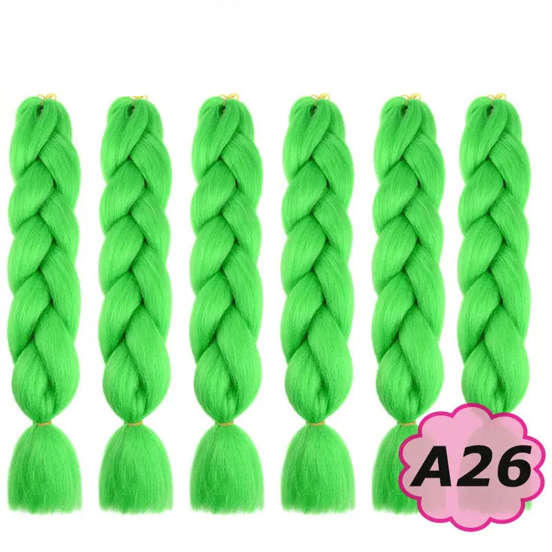 Green braided hair extensions with  branding on a white background.