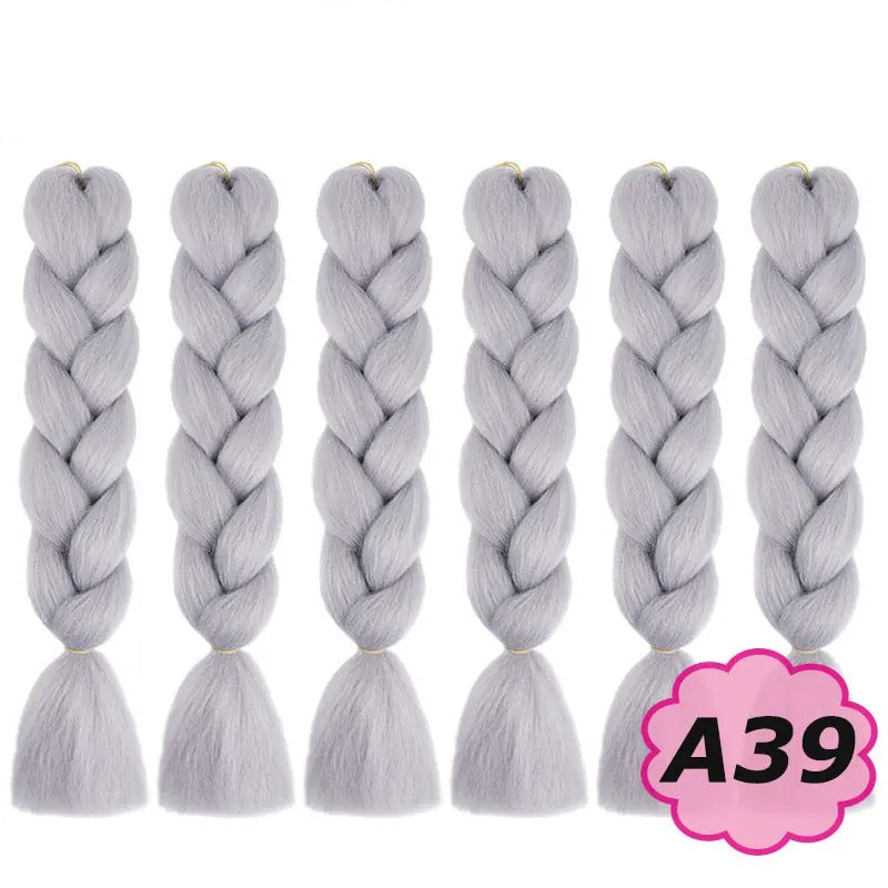 Gray braided hair extensions with branding on a white background.