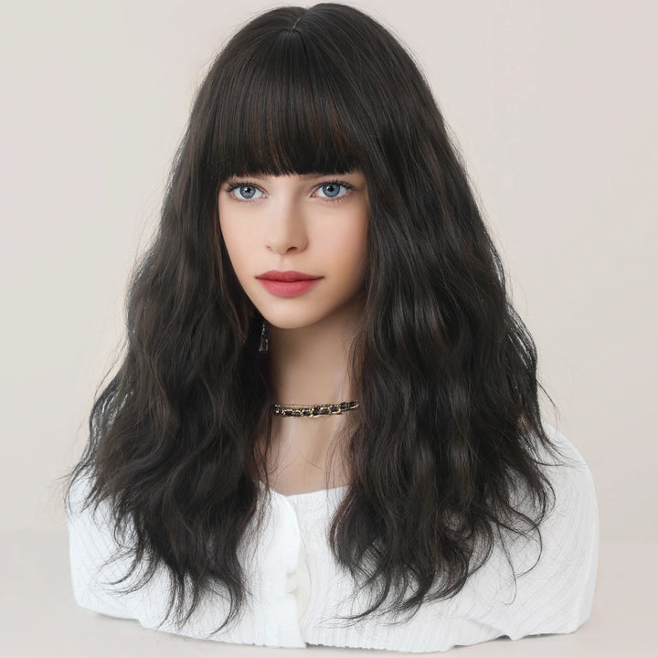 Short curly ombre blue wig with bangs for women. Shoulder-length wavy bob style made of synthetic hair. Perfect for daily wear, cosplay, and Halloween.