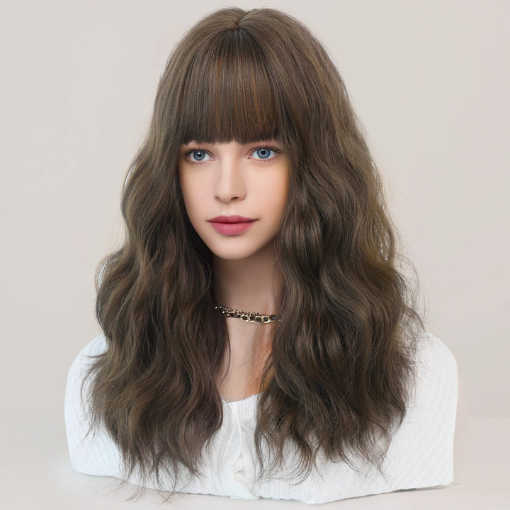 Short curly ombre blue wig with bangs for women. Shoulder-length wavy bob style made of synthetic hair. Perfect for daily wear, cosplay, and Halloween.