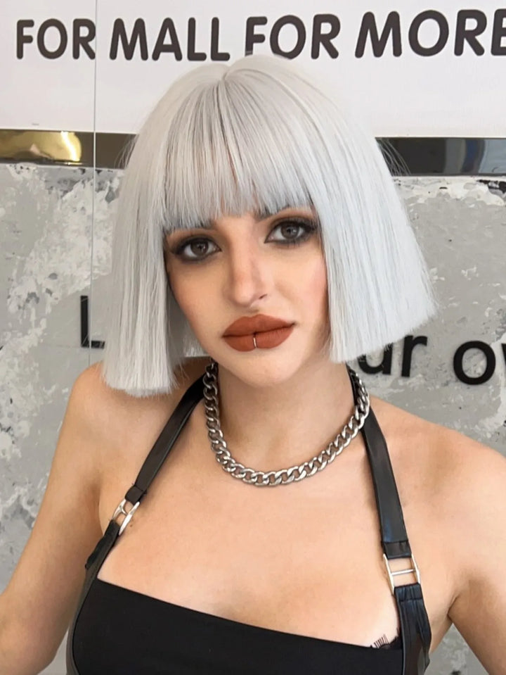 Ombre colored bob wig with bangs, perfect for cosplay or everyday wear.