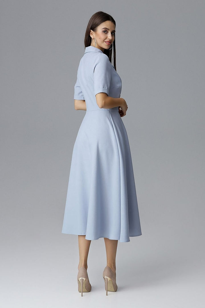 A 7/8-length double-breasted Daydress  Figl